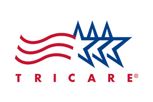 TRICARE logo with American flag stars and stripes design, military insurance accepted by Houston STD treatment center