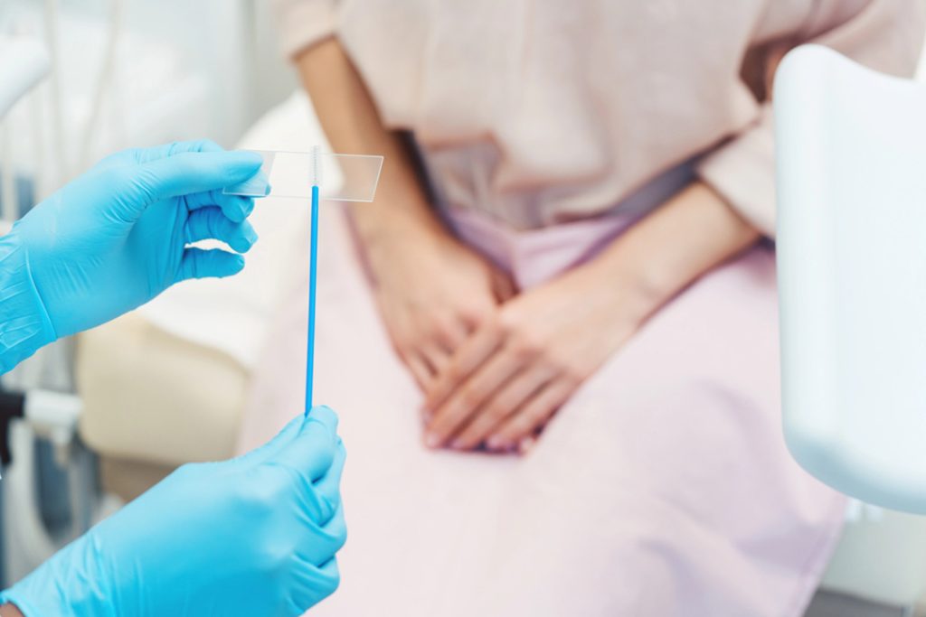 Clinician prepares cytobrush for Pap smear; preventive care and women’s health with trusted std testing houston services.