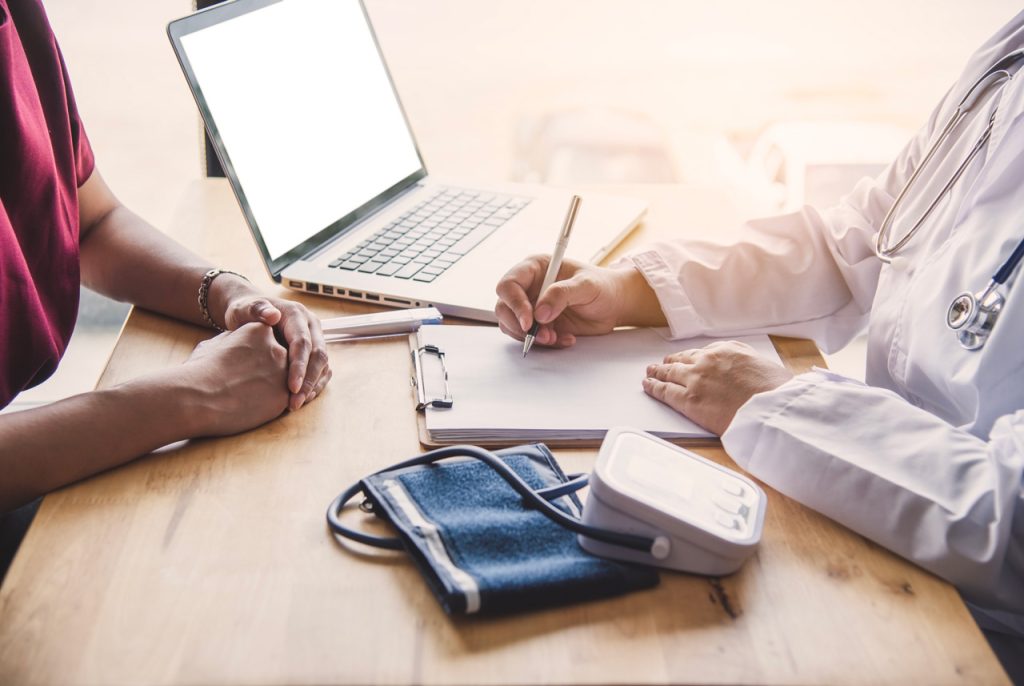 Professional physician providing affordable STD testing Houston consultations in a private and confidential medical office.