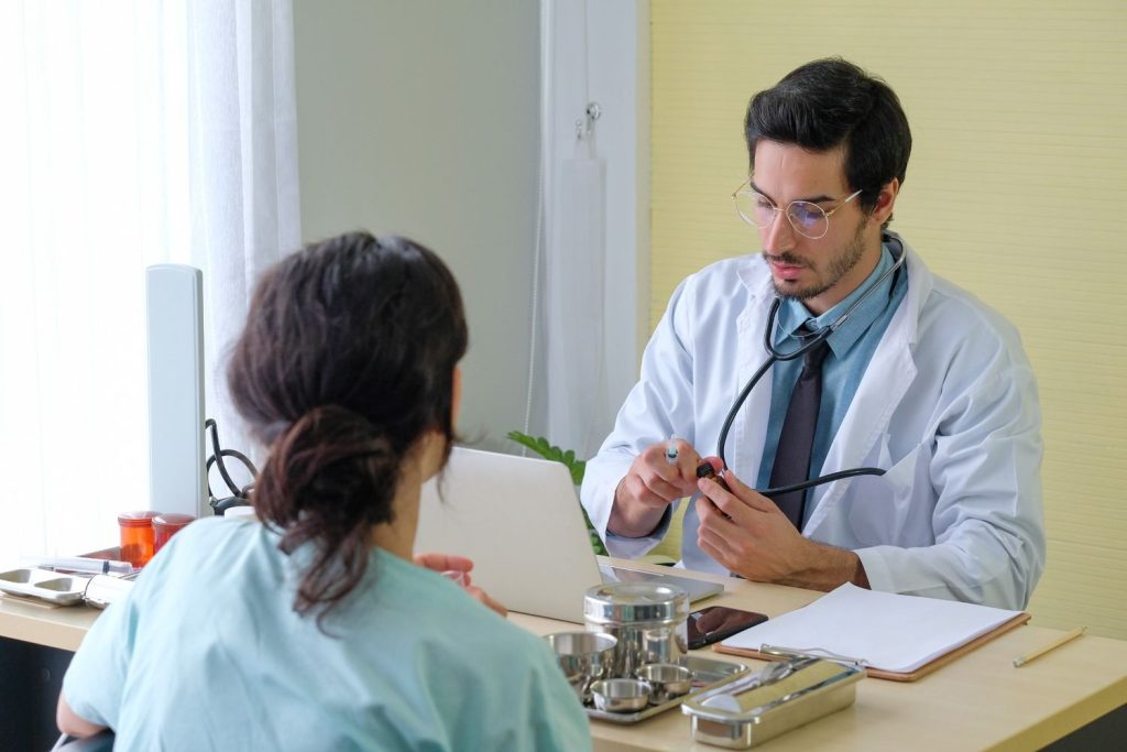 A physician discussing private results during a confidential STD testing Houston consultation in a medical office.